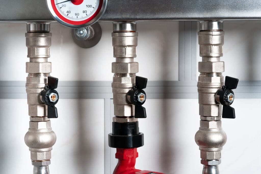 Stainless steel pipes of the heating system and water pipes in a house or apartment. Repair of plumbing heating pipes.