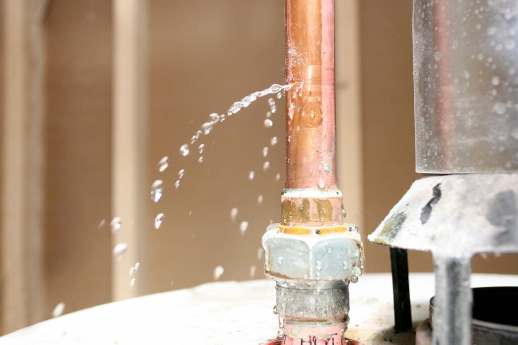 Close up of drain pipe leaking water